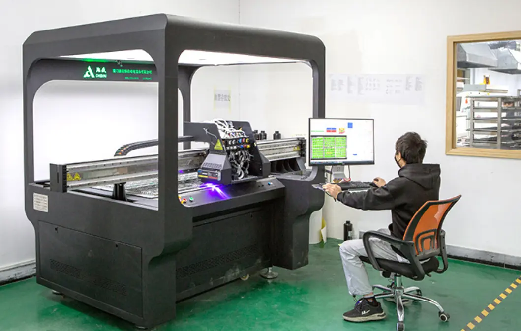 Operator working at the factory UV digital printer